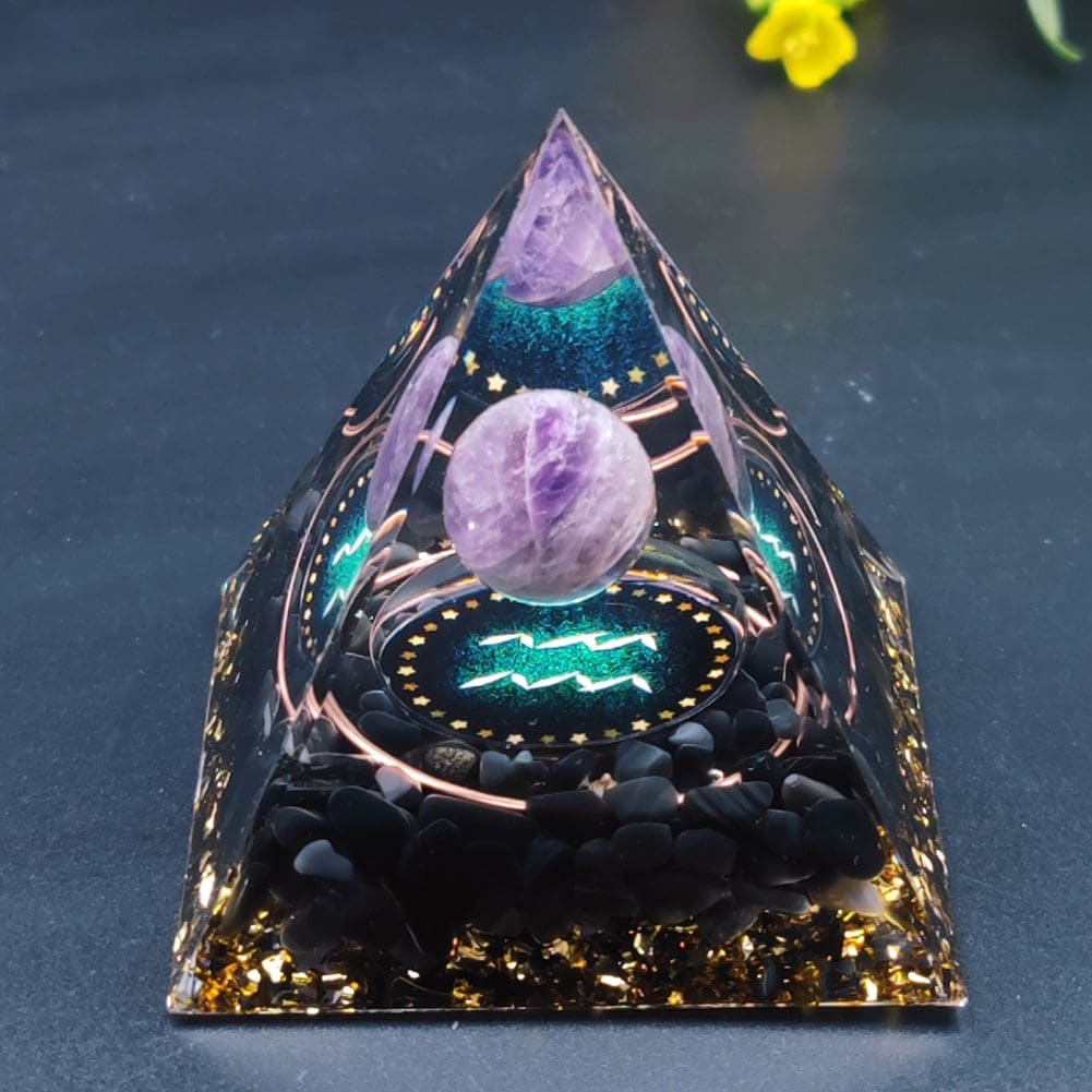 Aquarius Orgonite Pyramid with black obsidian, gold foil, copper, and an amethyst sphere.